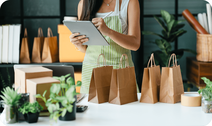 Small business owner preparing customer orders using a tablet