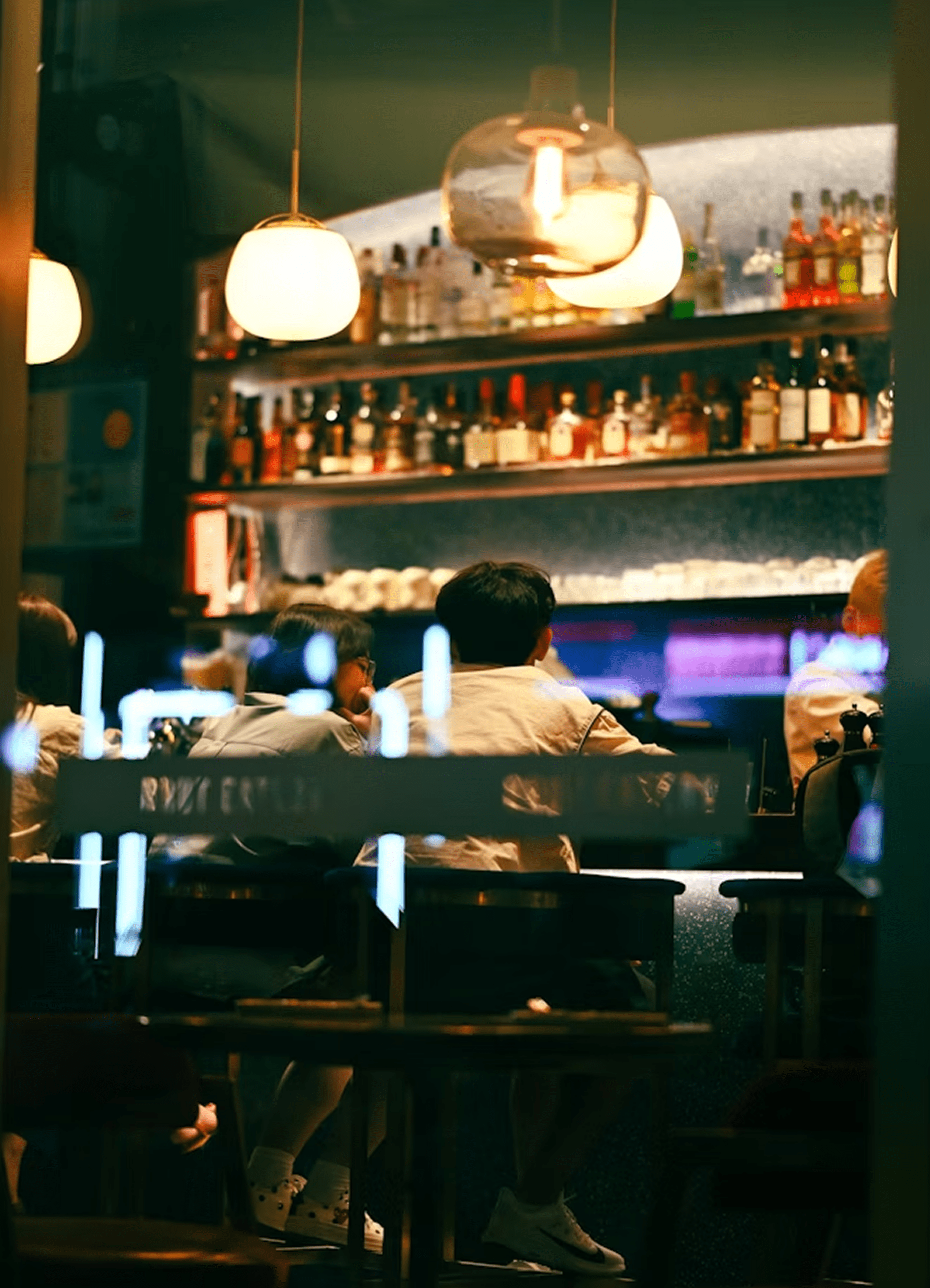 Customers gathered at bar counter