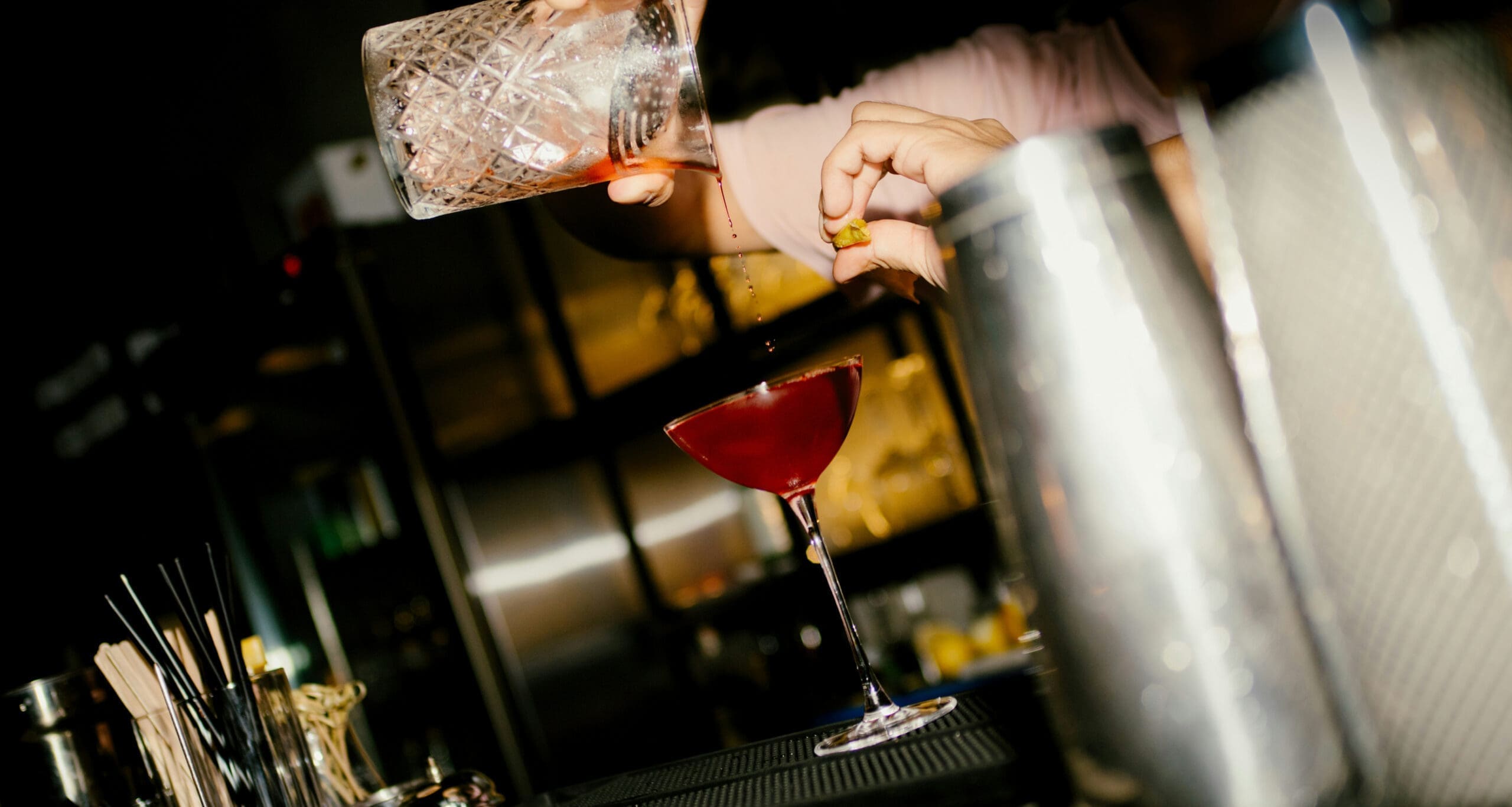 Bartender pouring cocktail