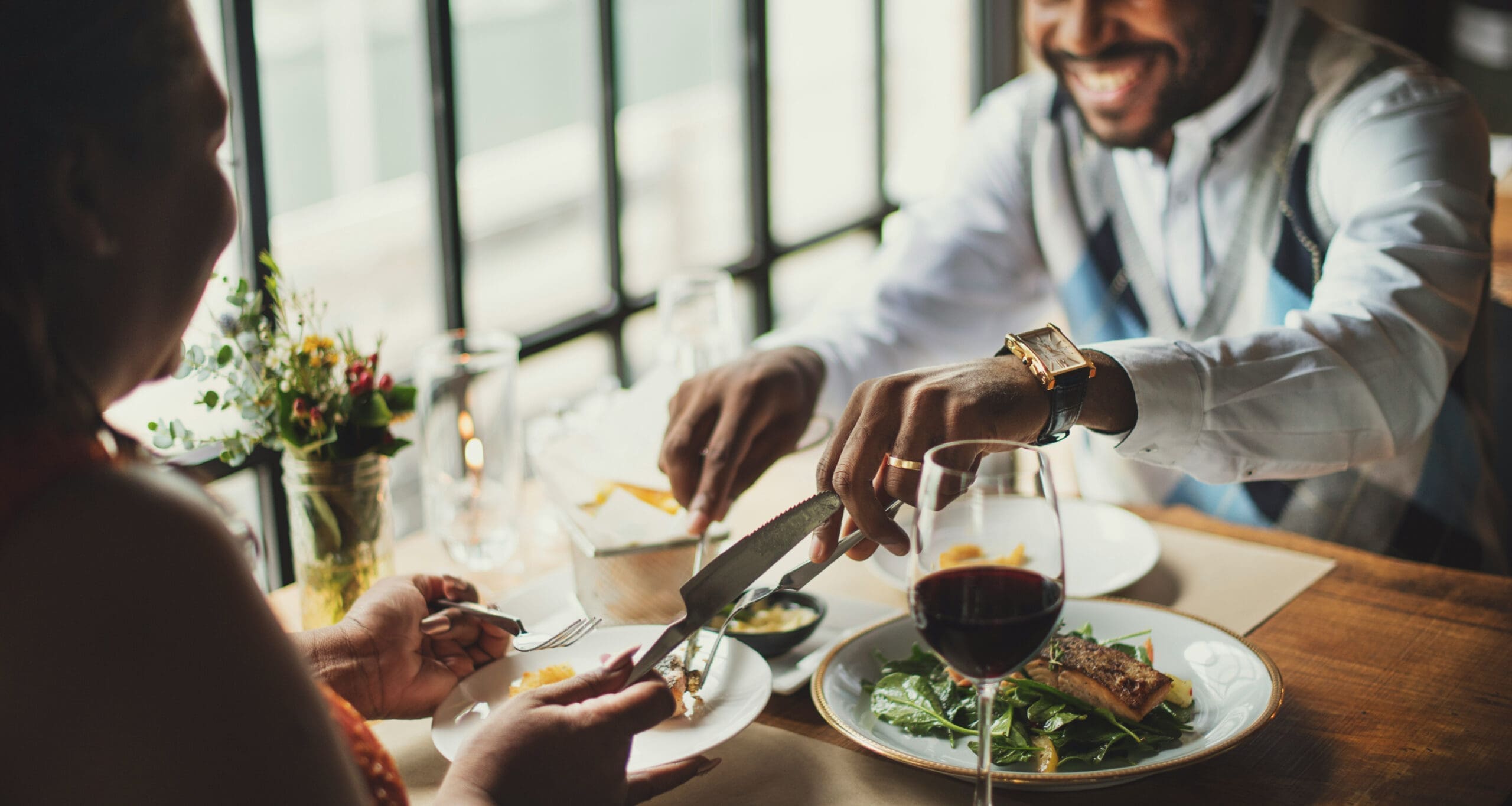 Customers dining at restaurant table