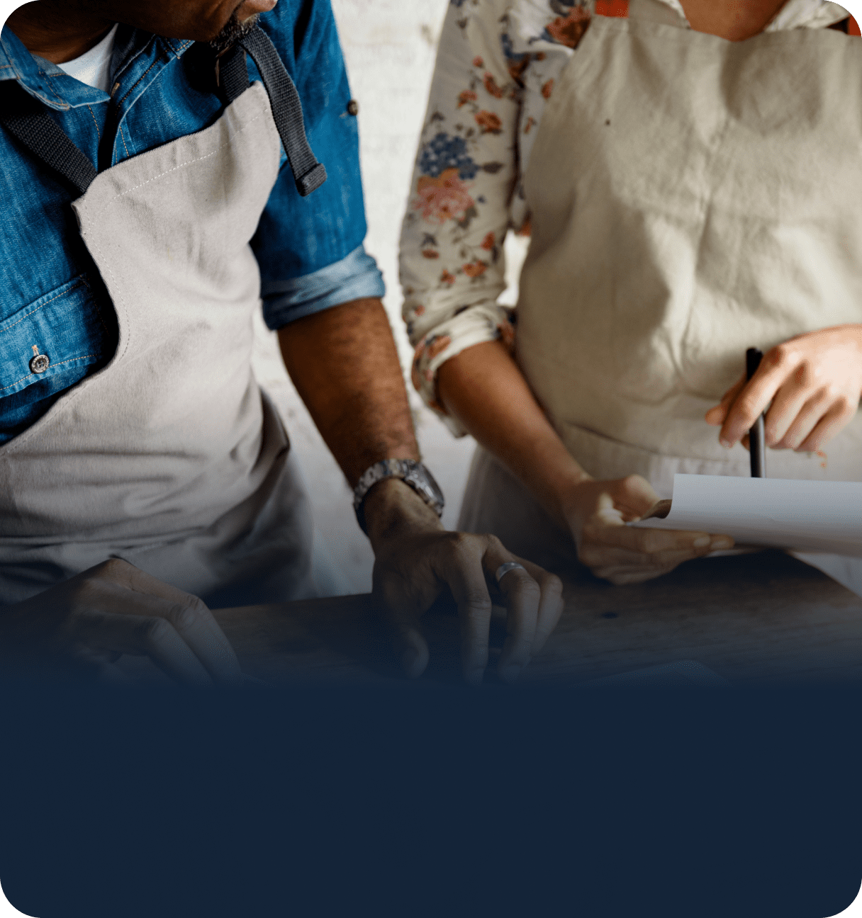 Staff processing payment with countertop terminal
