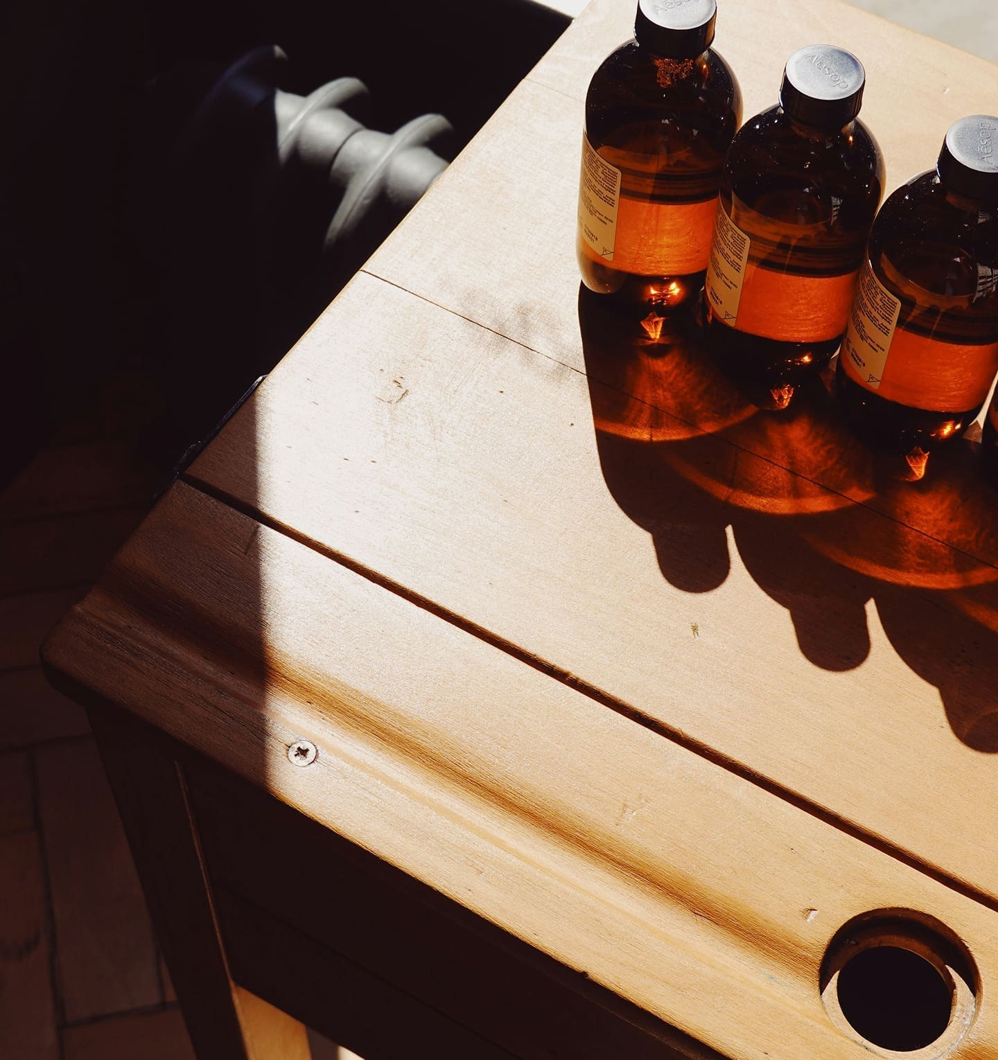 Glass bottles on wooden table