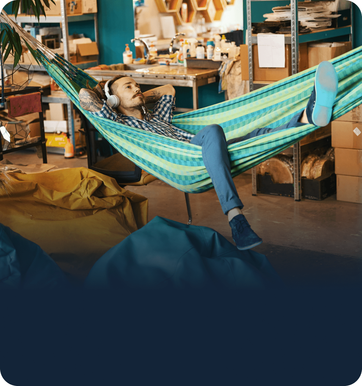 Person relaxing in hammock at workspace
